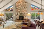The living area features a beautiful stone fireplace